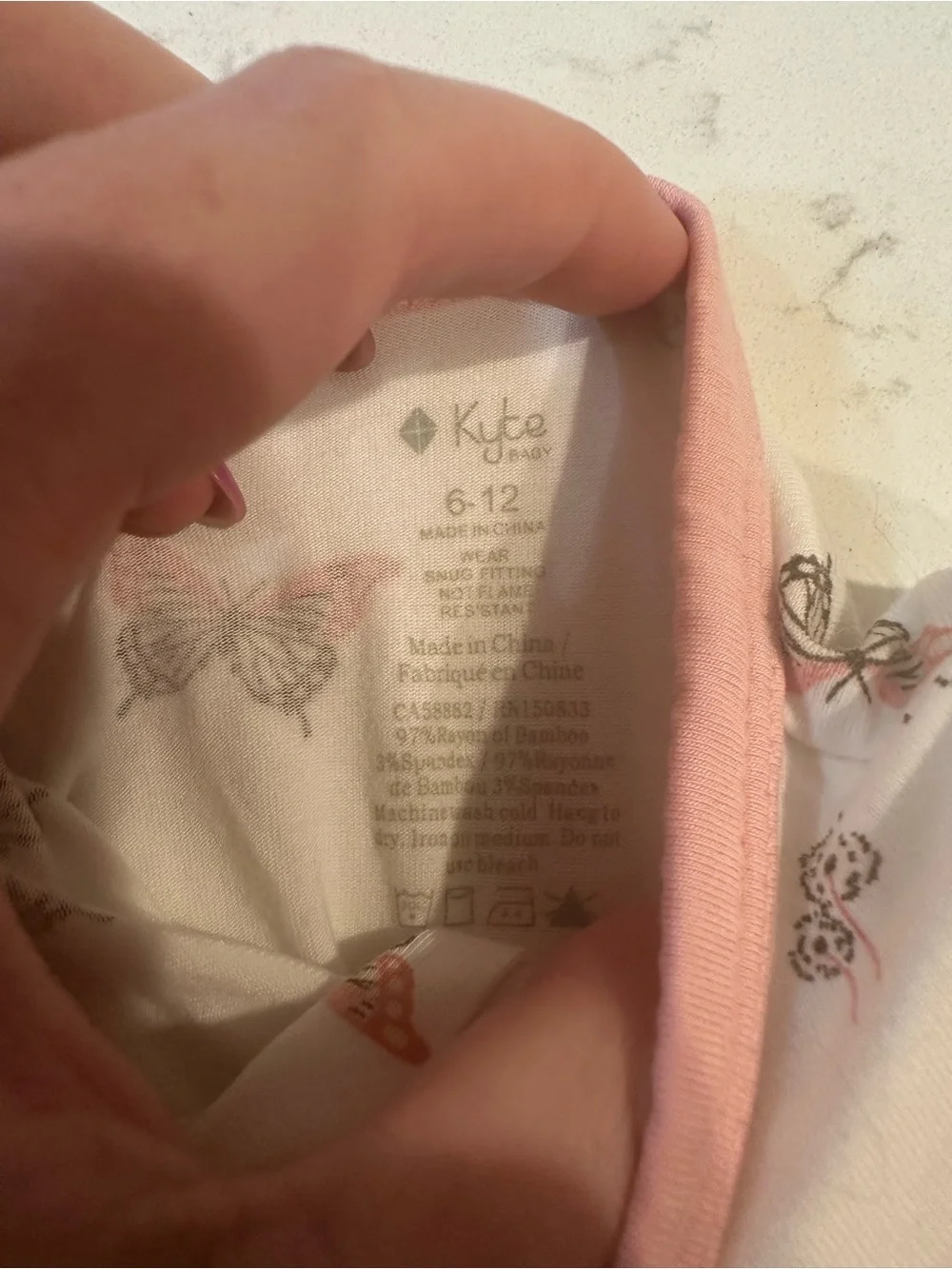 Kyte Baby pink butterfly footie